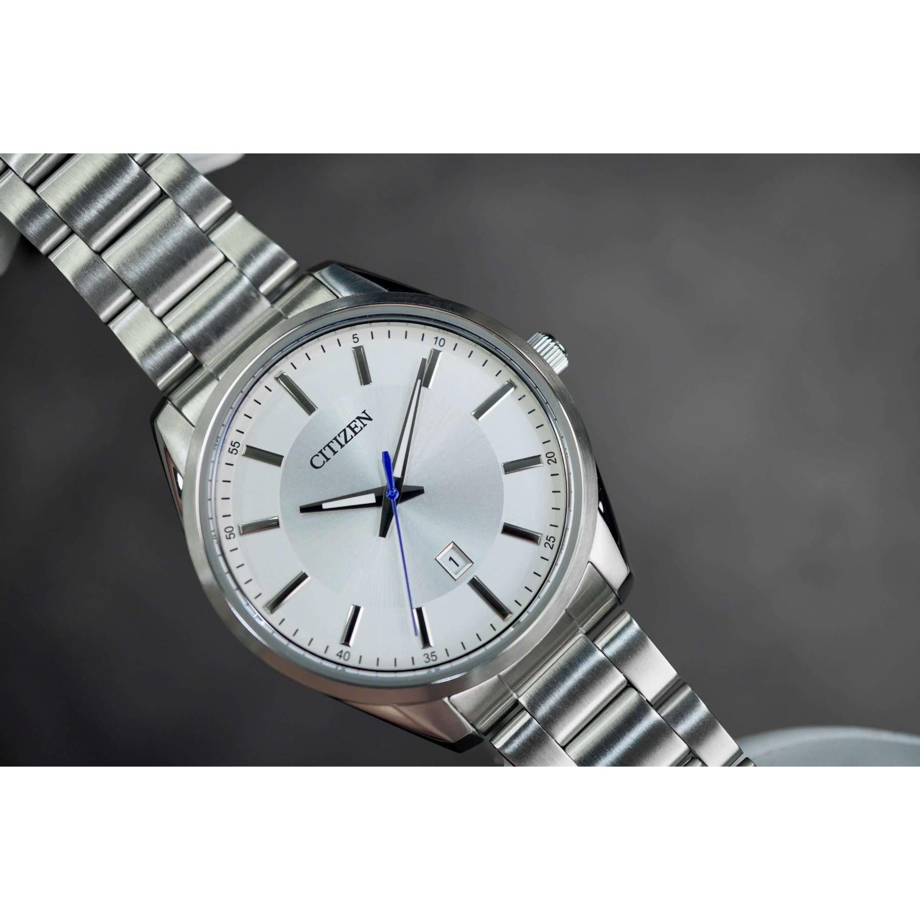 Citizen BI1030-53A mens dress watch close up with silver dial, date window and stainless steel bracelet showing refined elegant design