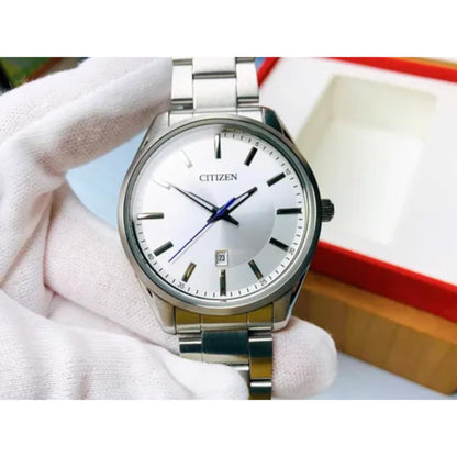 Citizen BI1030-53A mens watch with silver dial and stainless steel bracelet held in hand showing clean minimalist design and date window