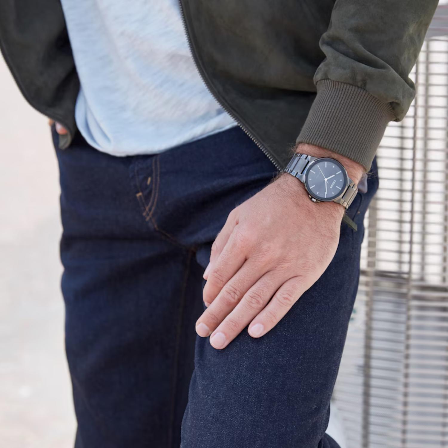 Citizen BJ6517-52E Eco-Drive dress watch with black dial and gray ion plated stainless steel bracelet worn on wrist with casual outfit and minimalist style