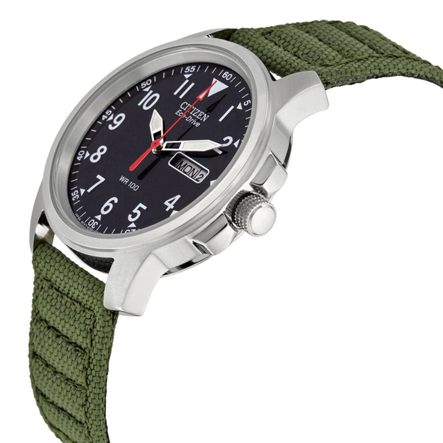 Citizen BM8180-03E with angled black dial, white Arabic numerals, day-date display, side crown, stainless steel case, and green nylon strap.