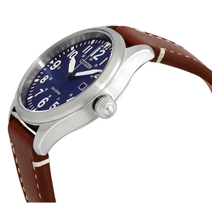 Citizen Eco Drive field watch angled side view with blue dial, stainless steel case, crown detail and brown leather strap