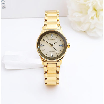 Citizen EM0732-51P womens dress watch front view with champagne dial, diamond hour markers and gold tone stainless steel bracelet on clean background