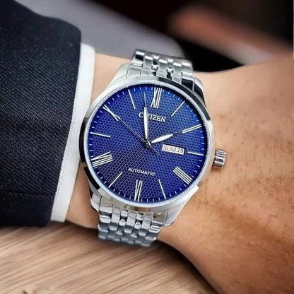 Citizen NH8350-59L automatic watch featuring a blue textured dial and day-date display worn on wrist