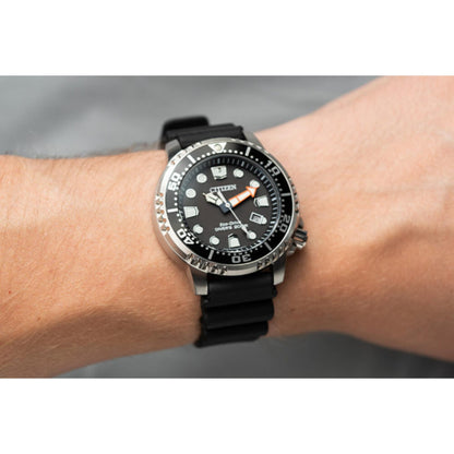 Citizen Promaster Diver BN0150-28E Eco-Drive dive watch worn on wrist with black dial, luminous markers, unidirectional bezel and black polyurethane strap.