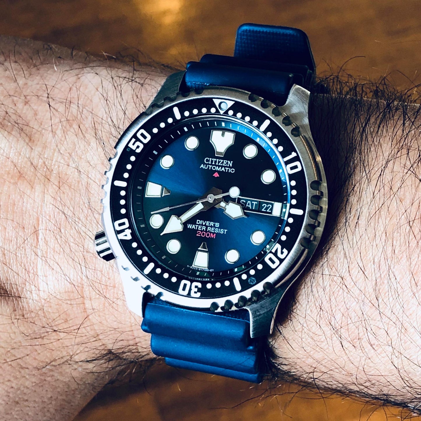 Citizen Promaster NY0040-17L automatic dive watch with blue dial and blue rubber strap, worn on the wrist.