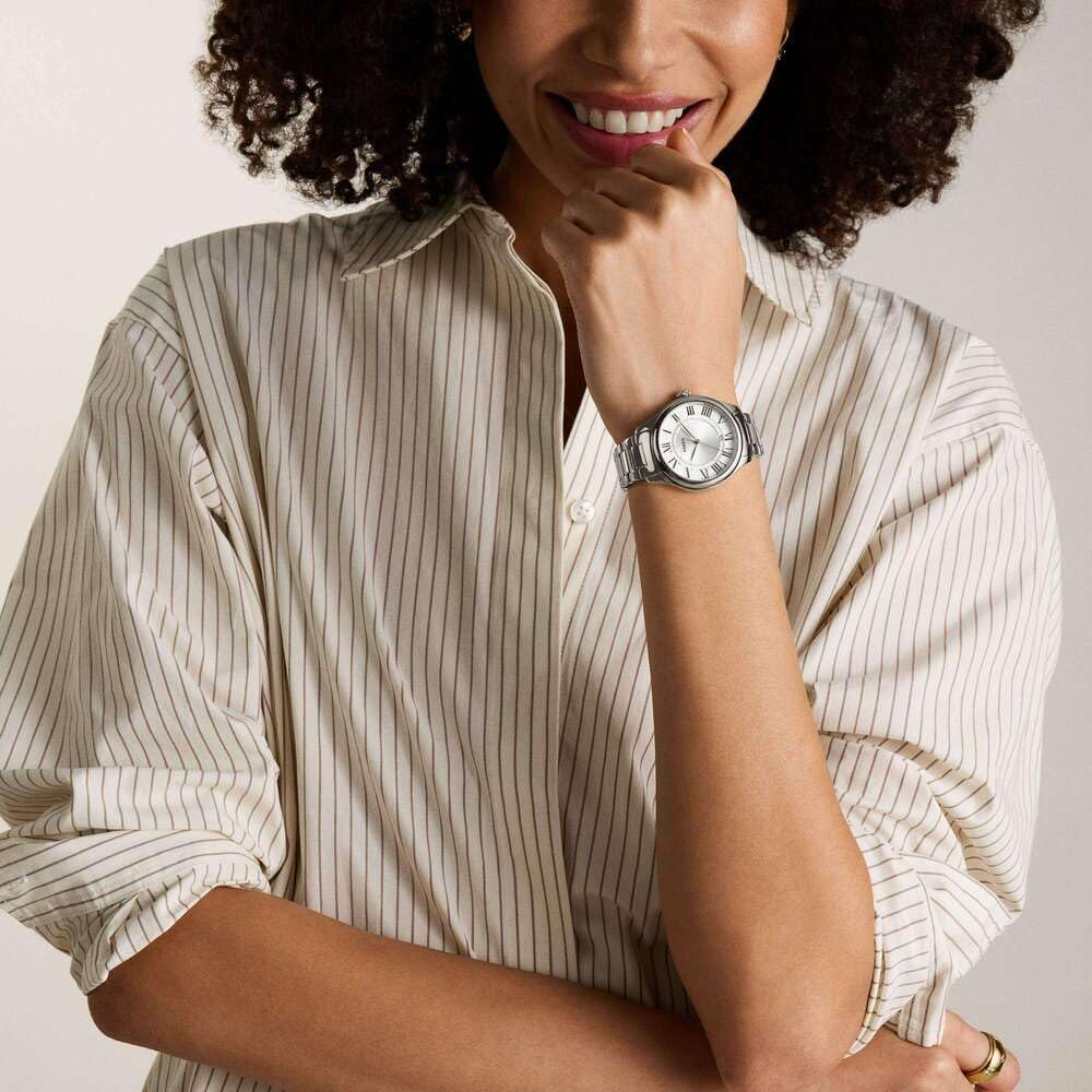 Fossil ES5393 worn on the wrist with silver dial, Roman numerals, stainless steel case and stainless steel bracelet.