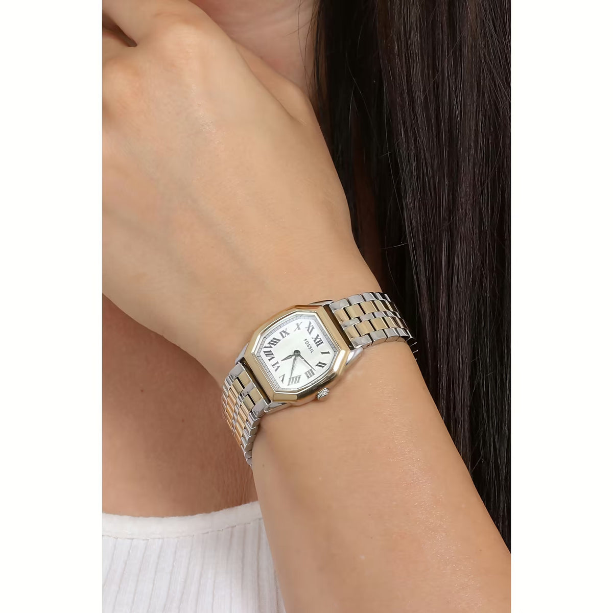 Fossil Harlow ES5362 with a white dial, black Roman numeral hour markers, two-tone silver and gold-tone case, and matching bracelet worn on the wrist.