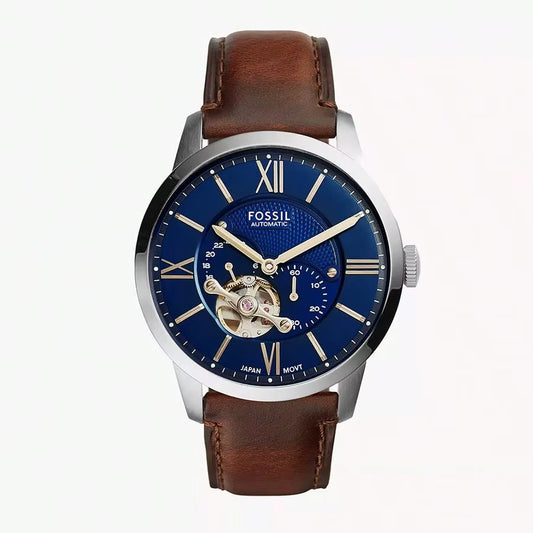 Reloj Fossil Heritage automático ME3263, esfera azul con ventana open heart, correa de piel marrón y detalles plateados.