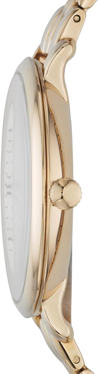 Vista lateral de la caja de un reloj Fossil para mujer en acero dorado con corona lateral.