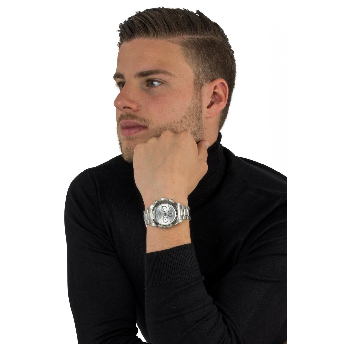 Invicta 14381 chronograph worn on the wrist with silver dial, tachymeter bezel, stainless steel case and stainless steel bracelet.