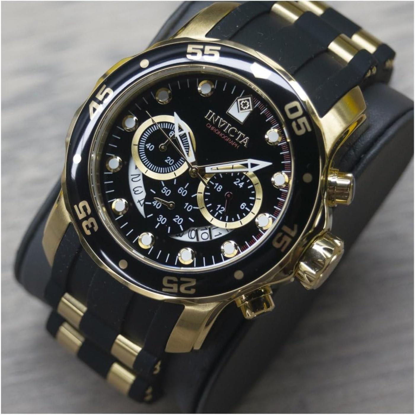 Invicta 6981 chronograph with black dial, three subdials, gold-tone stainless steel case, black bezel with gold markers and black strap with gold center links.