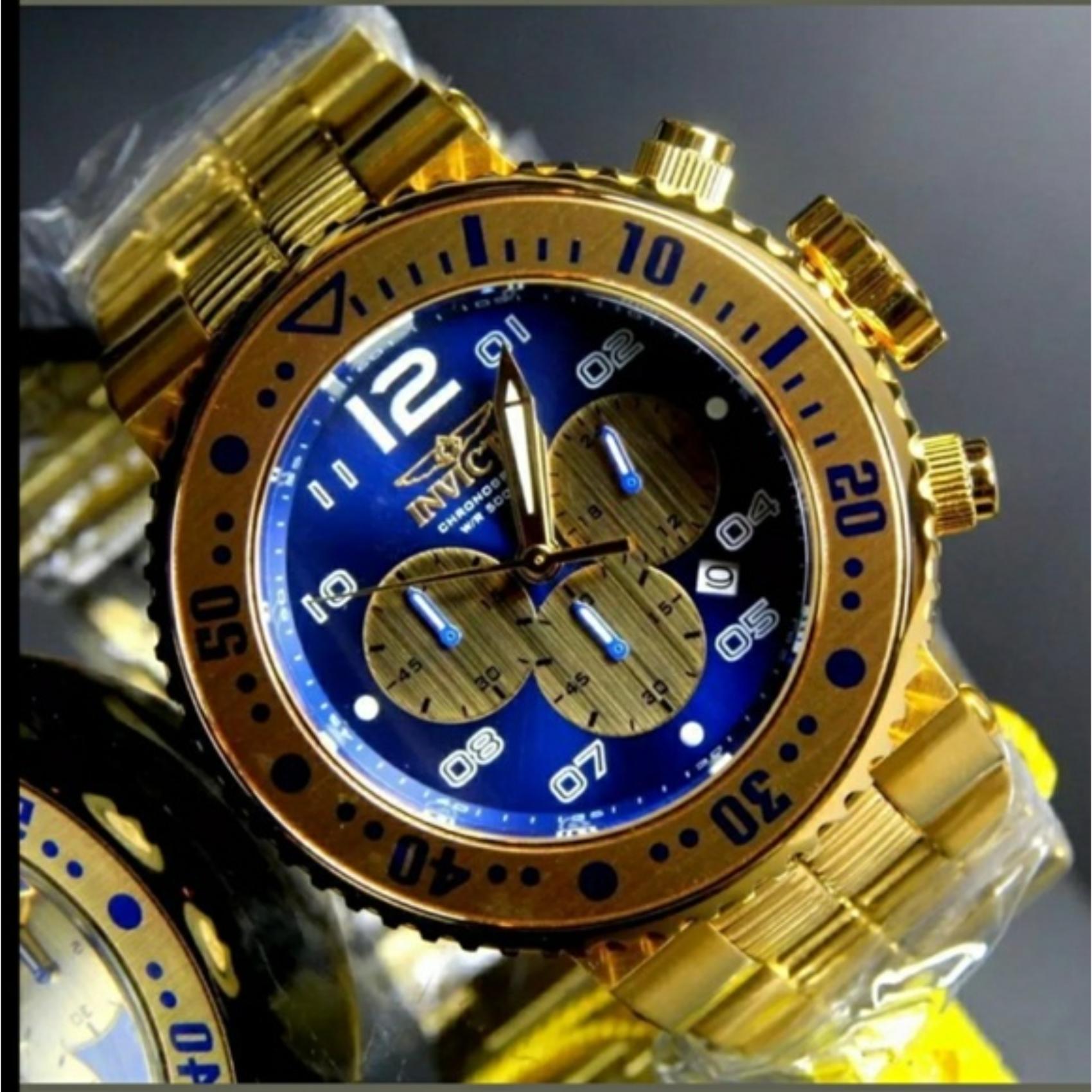 Invicta Pro Diver 25077 chronograph dive watch with blue dial, gold-tone subdials, oversized bezel markers and gold-tone stainless steel bracelet shown in close-up view.