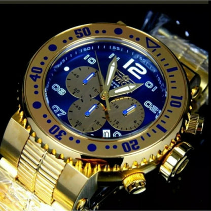 Invicta Pro Diver 25077 chronograph dive watch with blue dial, gold-tone subdials, oversized gold-tone bezel and stainless steel bracelet shown in macro angled view.