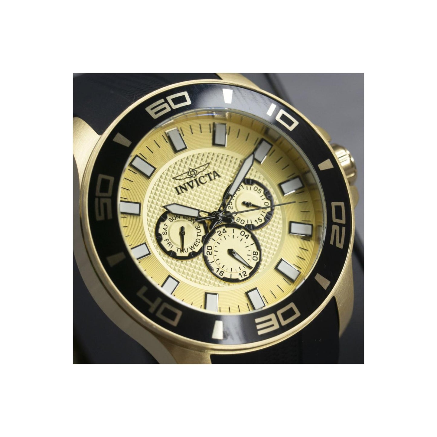 Invicta Pro Diver 35742 close-up showing the gold-tone textured chronograph dial, black bezel with large numerals, and luminous hour markers.