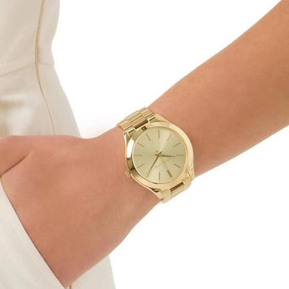 Michael Kors MK3179 Slim Runway gold-tone women’s watch worn on wrist with minimalist dial and polished stainless steel bracelet.