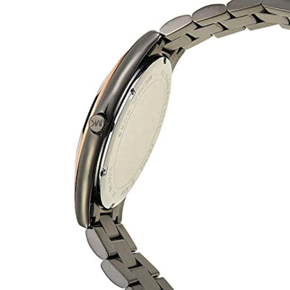 Michael Kors MK8576 with gunmetal stainless steel case, engraved crown, stainless steel caseback and matching link bracelet shown in angled rear profile.