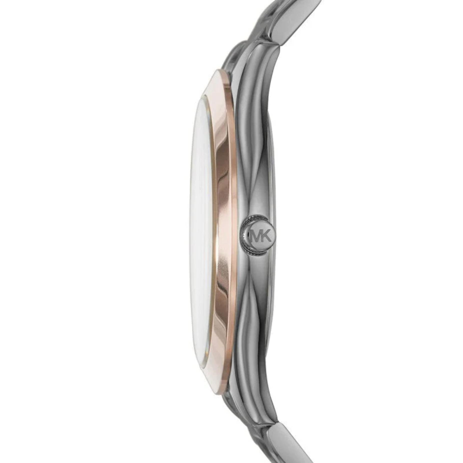 Michael Kors MK8576 with slim gunmetal stainless steel case, rose gold-tone bezel accents and engraved crown shown in side profile.