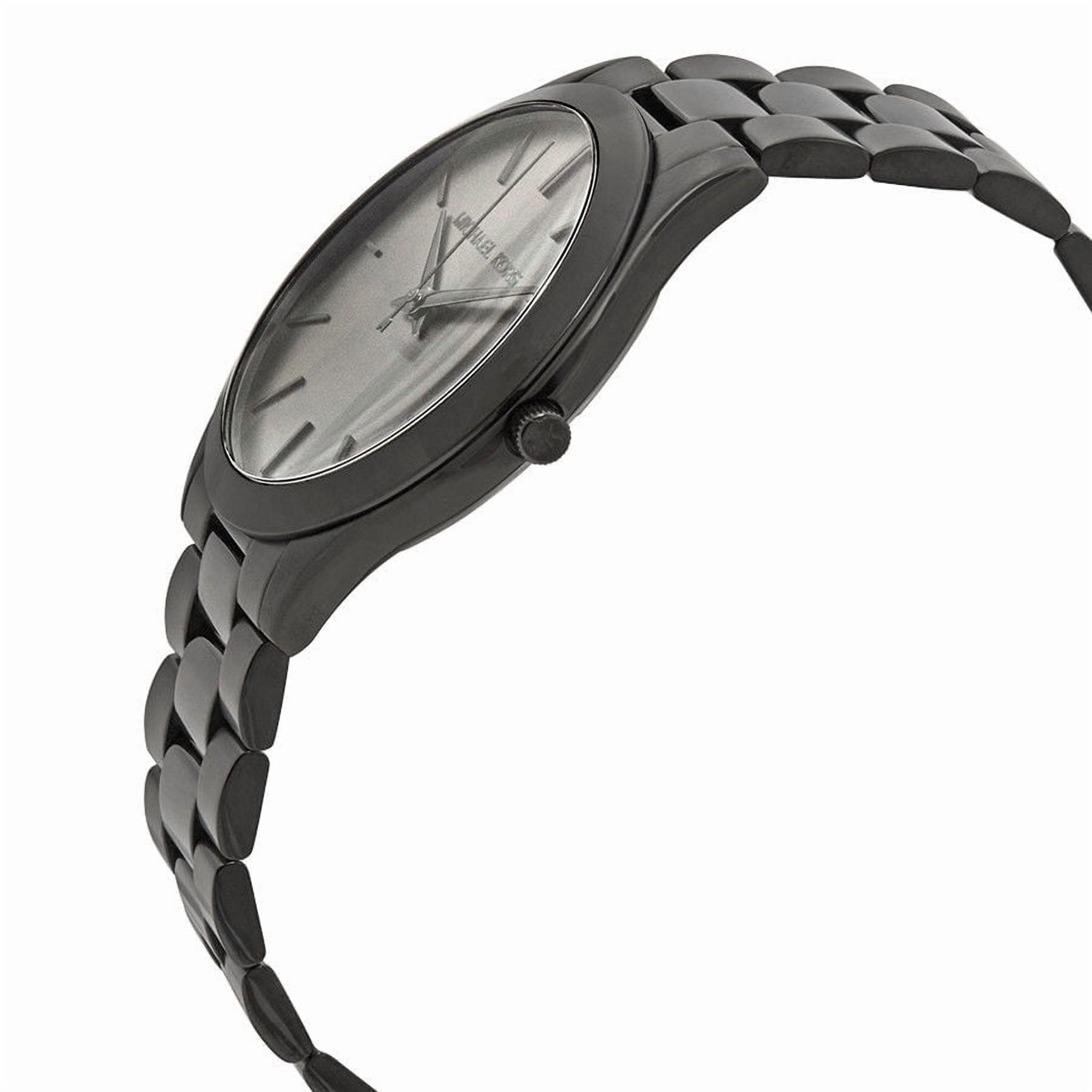 Michael Kors Slim Runway MK8507 with slim black stainless steel case, minimalist dial and black link bracelet shown in side profile.