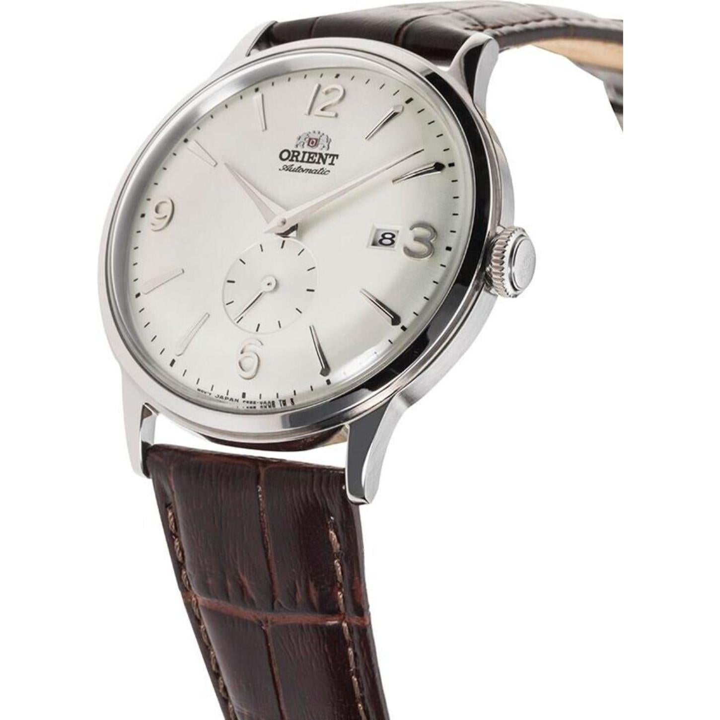 Orient Bambino Small Seconds RA-AP0002S10B automatic dress watch with white dial, small seconds subdial, silver-tone case, and brown crocodile-pattern leather strap shown in an angled view.