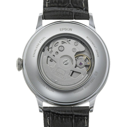 Orient Bambino Version 8 RA-AK0704N10B automatic dress watch with exhibition caseback showing Epson automatic movement and dark crocodile-pattern leather strap.