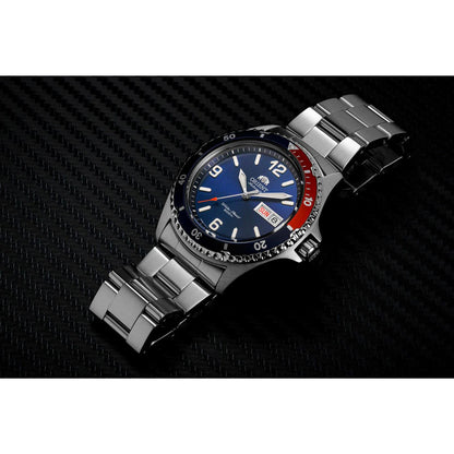 Orient Mako II AA02009D automatic dive watch with blue dial, Pepsi-style red and blue bezel and stainless steel bracelet displayed in dark lifestyle setting.