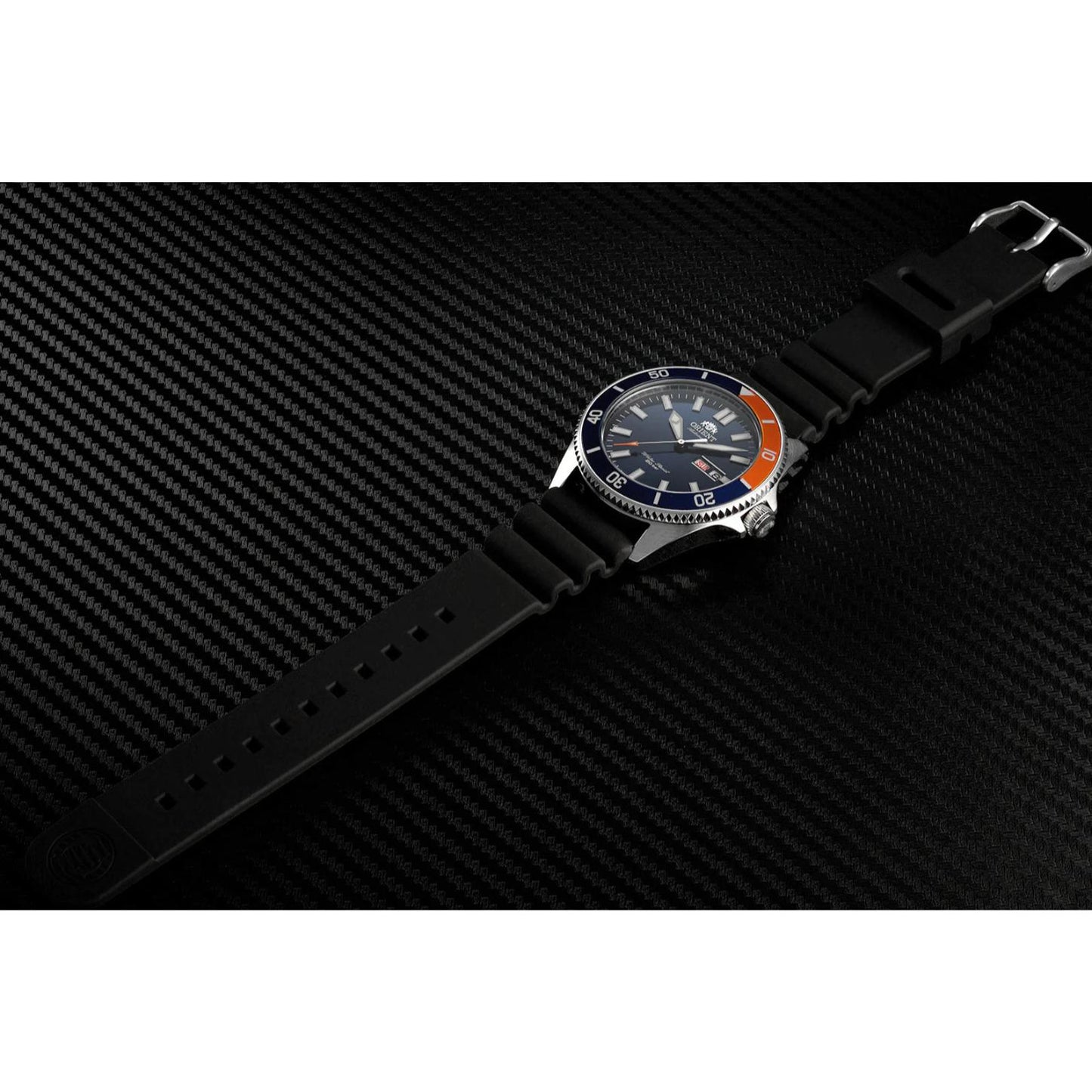 Orient RA-AA0916L19B automatic dive watch with blue dial, blue and orange bezel, and black rubber strap displayed on a textured black surface.
