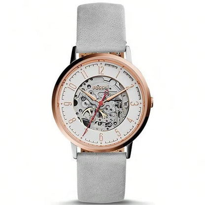 Reloj Fossil Townsman Automatic Skeleton modelo ME3131, caja oro rosa, esfera esqueleto y correa gris de ante, movimiento automático a la vista.