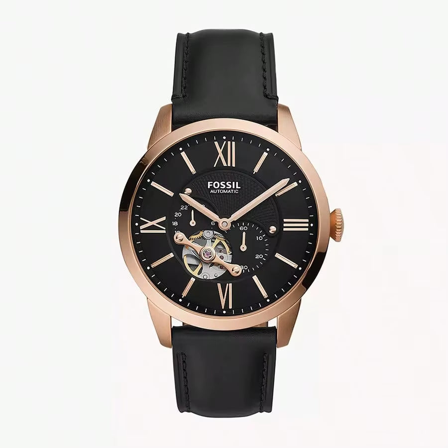 Reloj Fossil ME3265 automático con caja de acero acabado oro rosado, esfera negra open heart y correa de cuero negra, vista frontal.