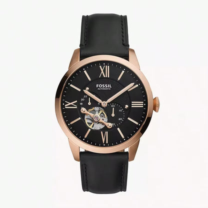 Reloj Fossil ME3265 automático con caja de acero acabado oro rosado, esfera negra open heart y correa de cuero negra, vista frontal.