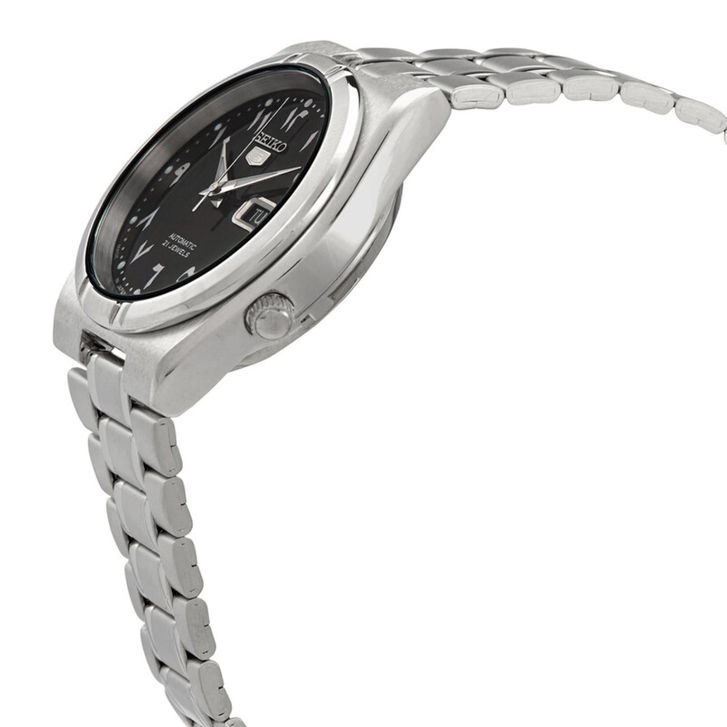 Side profile of the Seiko 5 SNK063J5 automatic watch showing the black Arabic numeral dial, silver-tone case, crown, and stainless steel bracelet.