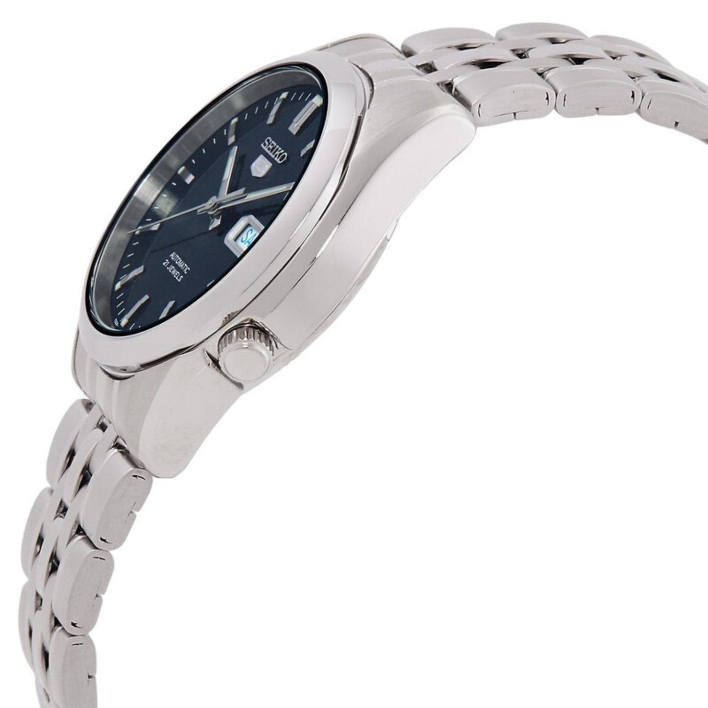 Side profile of the Seiko 5 SNK357K1 automatic watch showing the blue dial, polished case, crown, curved lugs, and stainless steel bracelet.
