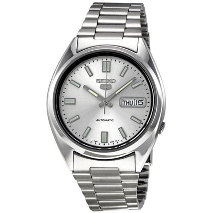 Seiko 5 SNXS73K1 automatic watch featuring a silver dial, luminous hands and hour markers, day-date display, polished silver-tone case, and stainless steel bracelet.