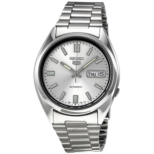 Seiko 5 SNXS73K1 automatic watch featuring a silver dial, luminous hands and hour markers, day-date display, polished silver-tone case, and stainless steel bracelet.