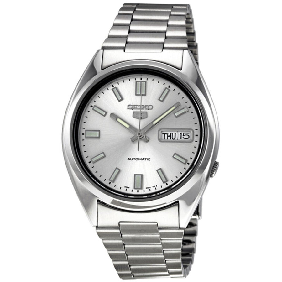 Seiko 5 SNXS73K1 automatic watch featuring a silver dial, luminous hands and hour markers, day-date display, polished silver-tone case, and stainless steel bracelet.