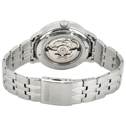 Seiko Essentials SRPH89K1 men's automatic watch highlighting the exhibition case back and stainless steel bracelet with signed clasp.