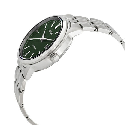 Seiko Essentials SRPH89K1 men's automatic watch in profile view showcasing the polished stainless steel case and green sunburst dial.