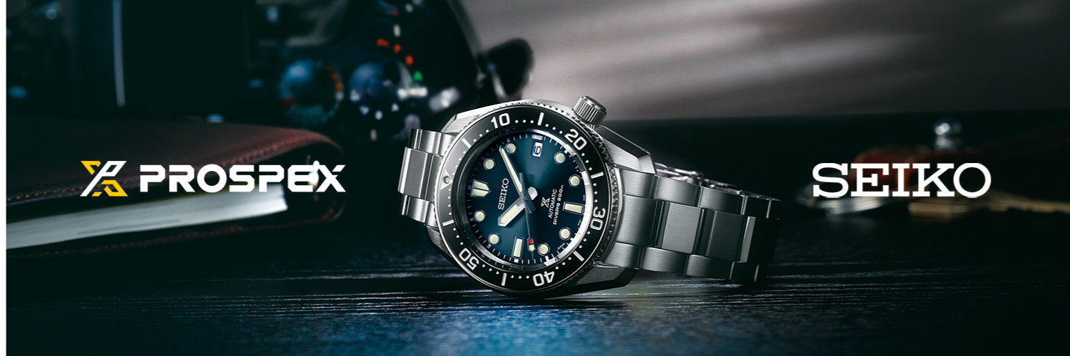 Seiko Prospex diver watch with blue dial, luminous markers, black rotating bezel, and stainless steel bracelet