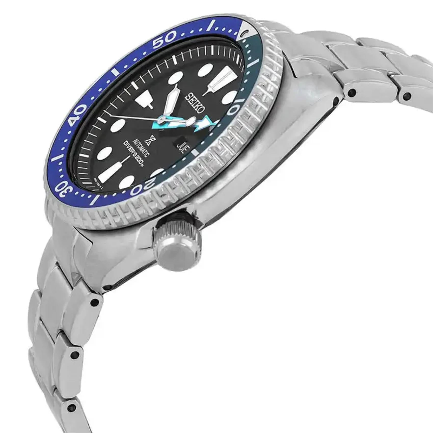 Seiko Prospex SRPJ35 automatic dive watch with black dial, Tropical Lagoon blue-green bezel and stainless steel bracelet shown in angled side profile.