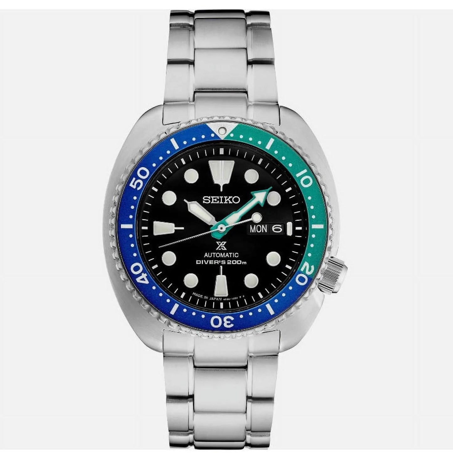 Seiko Prospex SRPJ35 automatic dive watch with black dial, Tropical Lagoon blue-green bezel, luminous markers and stainless steel bracelet.