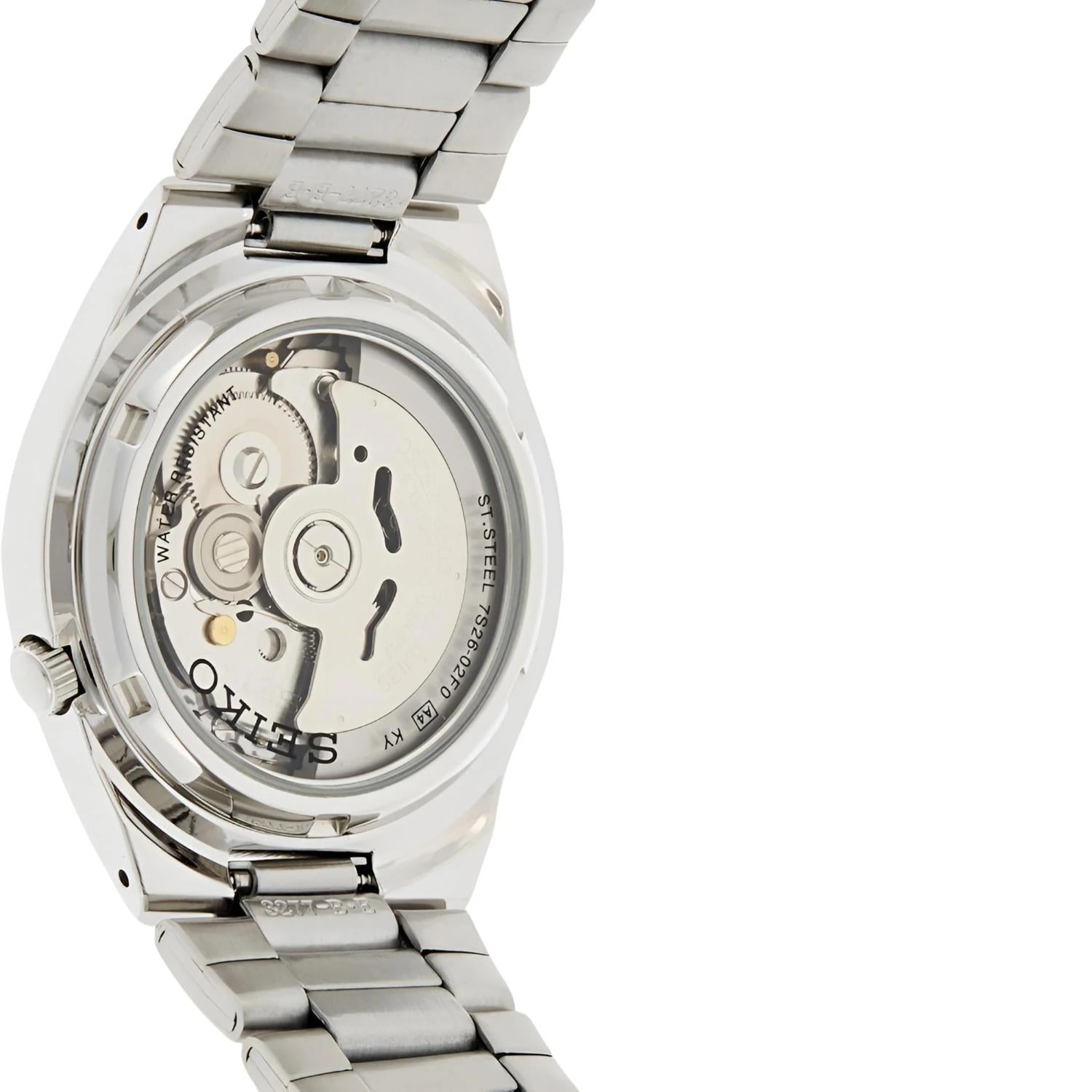 Seiko SNK615K with transparent caseback showing automatic movement, stainless steel case and stainless steel bracelet.