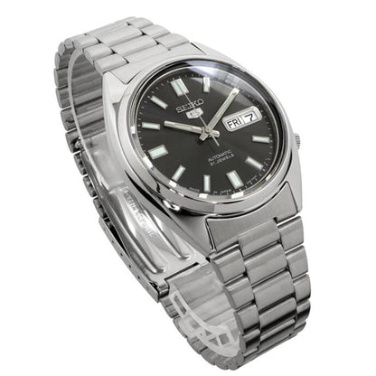 Seiko SNXS79K1 automatic watch with black dial, day-date display and stainless steel bracelet shown at an angle.
