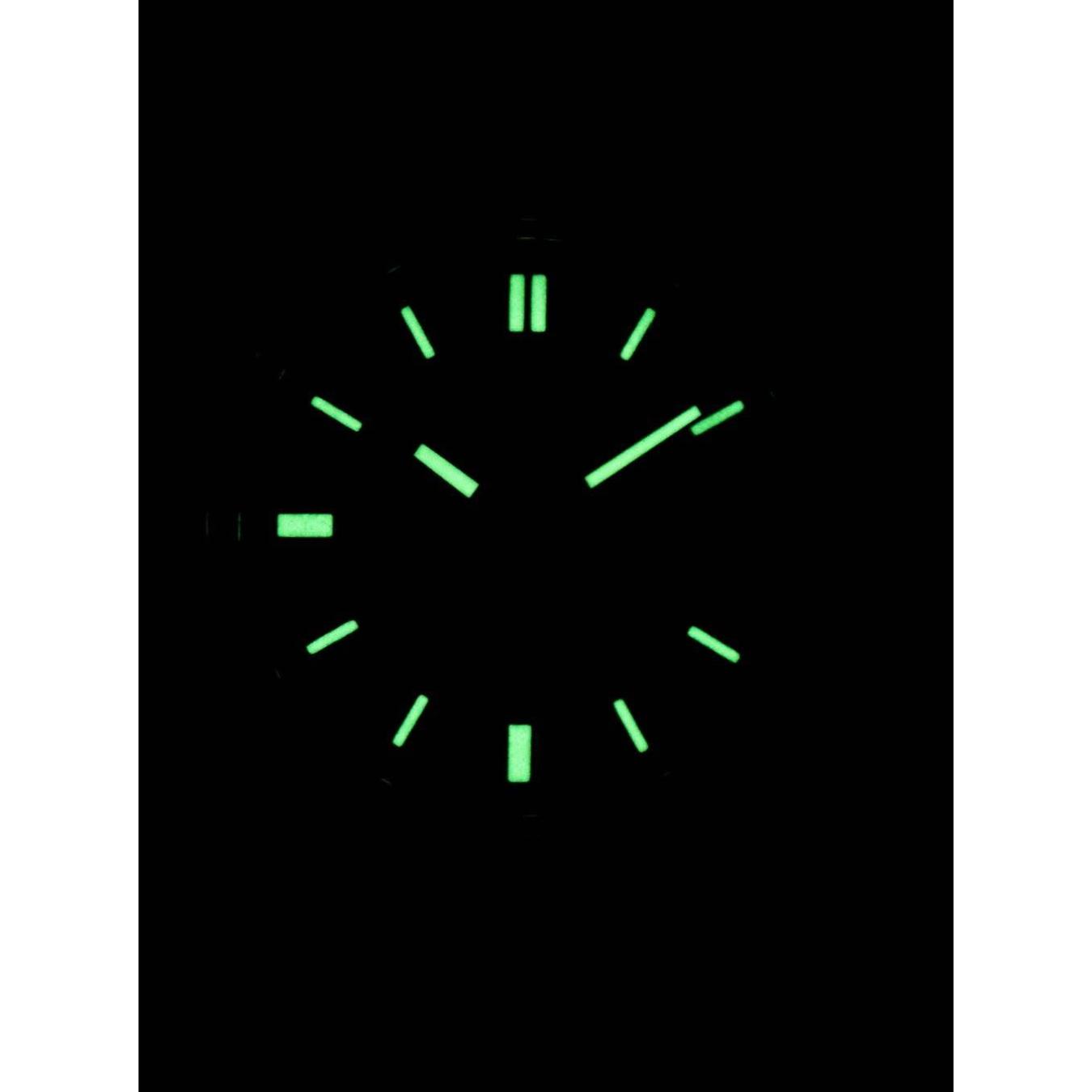 Seiko SNXS79K1 dial lume glowing in the dark showing illuminated hands and hour markers.