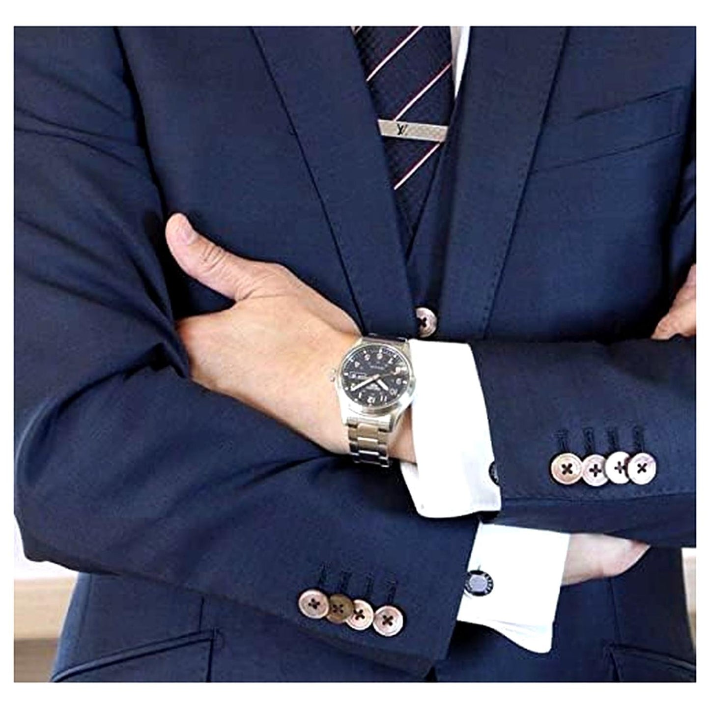 Seiko SRPG29K1 mens automatic field watch with blue dial and stainless steel bracelet worn with suit in formal style