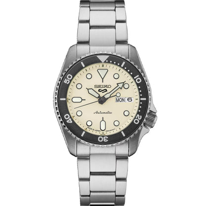 Seiko SRPK31 automatic dive watch with cream dial, luminous markers, rotating bezel, day and date display, stainless steel case and stainless steel bracelet.