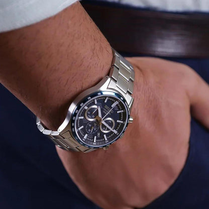 Seiko SSB445P1 chronograph watch worn on the wrist with blue dial, subdials and stainless steel bracelet.