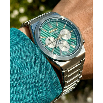 Seiko SSB461P1 men's quartz chronograph watch featuring a textured green dial and stainless steel integrated bracelet worn on the wrist