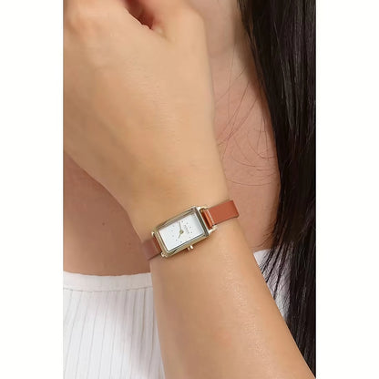 Skagen Hagen Micro SKW3149 women's quartz watch with a white dial and brown leather strap styled on a woman's wrist.