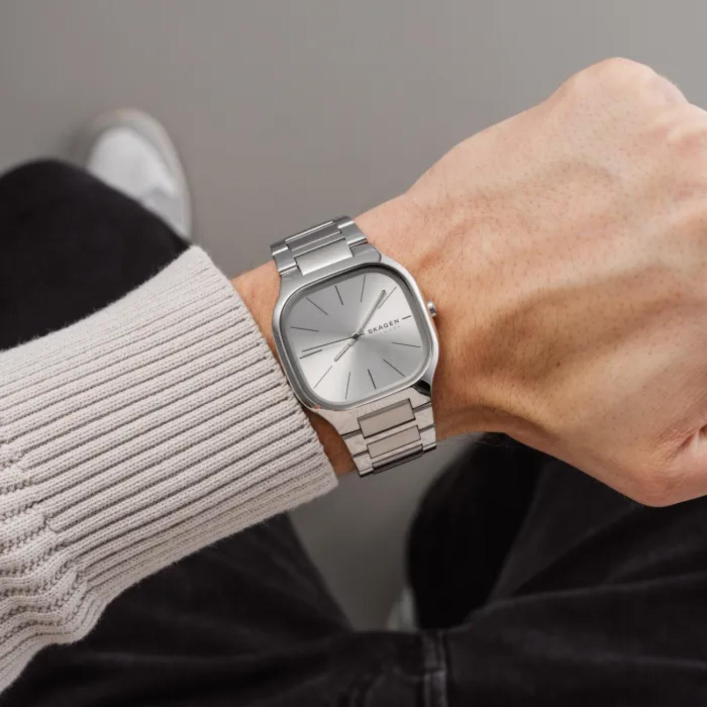 Skagen Mellem SKW6934 women’s minimalist stainless steel watch with silver dial and integrated bracelet worn on wrist in casual lifestyle setting.