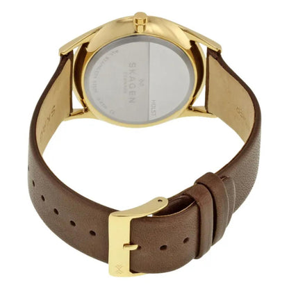Skagen SKW6225 with polished gold-tone rear case, brown leather strap, and gold-tone pin buckle closure with slim minimalist design.