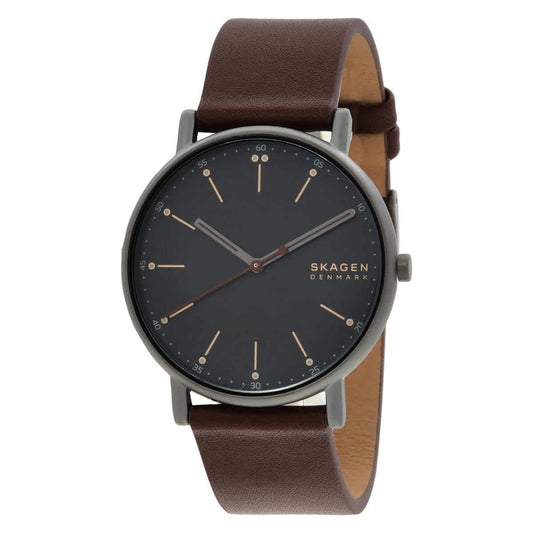 Skagen SKW6860 minimalist watch with black dial, slim gunmetal-tone case, rose gold-tone markers, and brown leather strap.